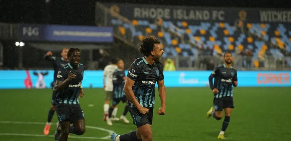 Players celebrating a goal during match