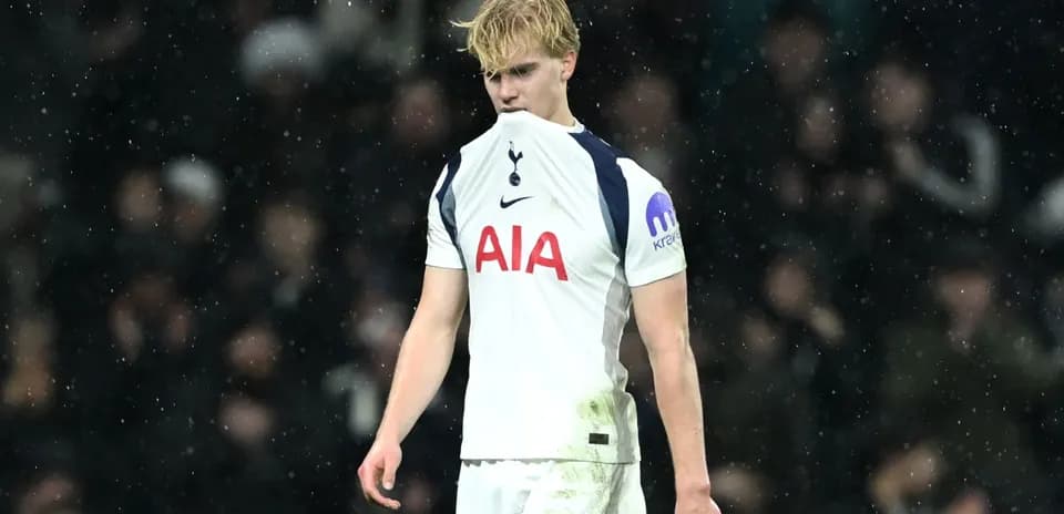 Player in Tottenham kit looking dejected on field