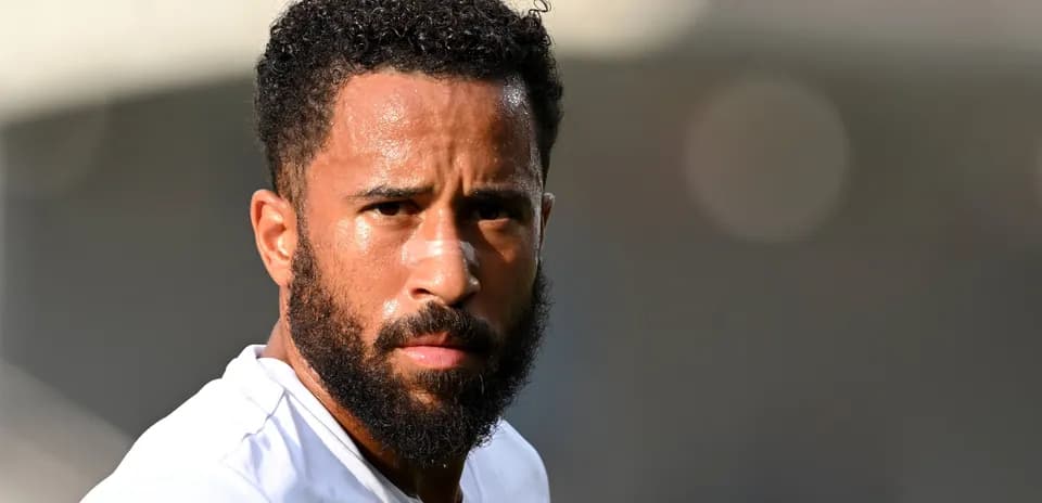 Player with a beard and bandage on nose