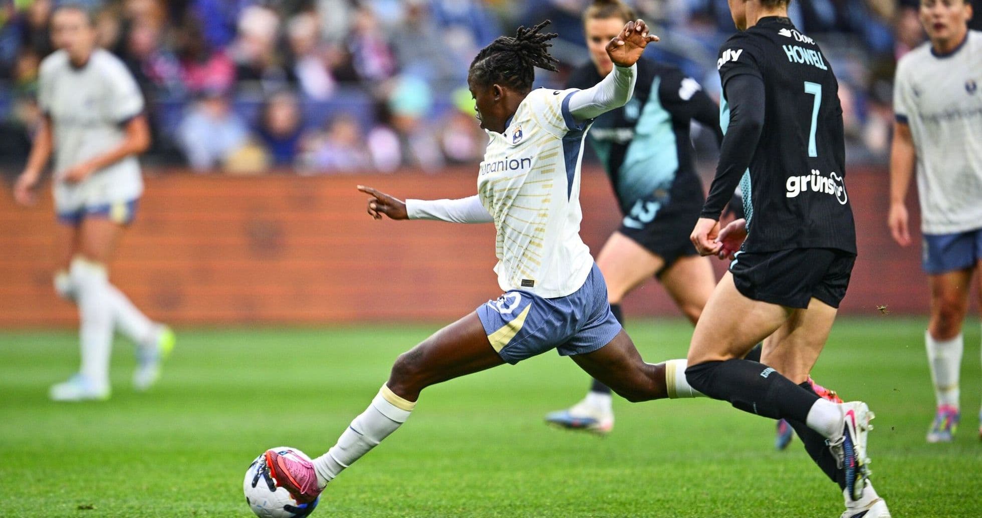 Player kicking ball during Seattle Reign match