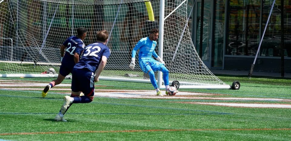 Goalkeeper preparing to kick the ball