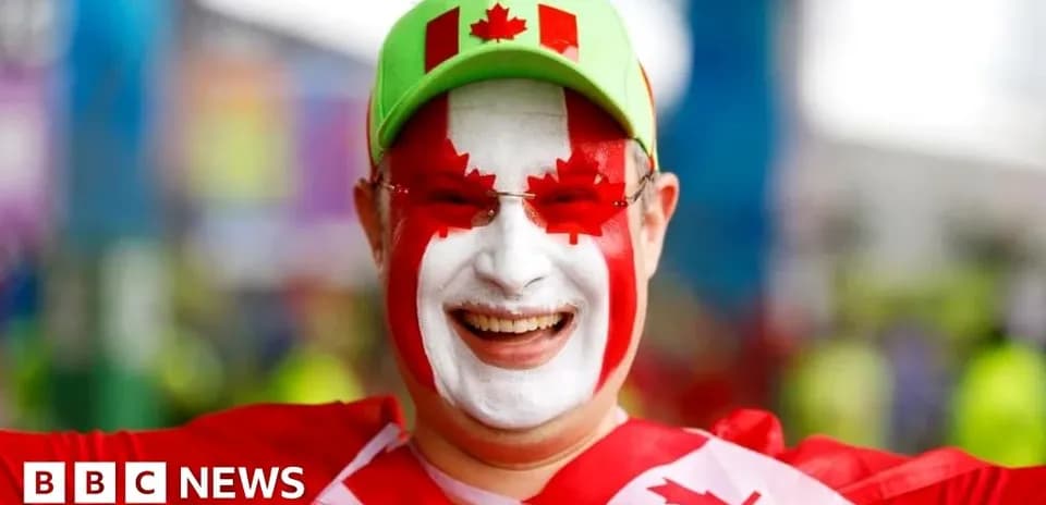 Fan celebrating with painted face and Canadian attire