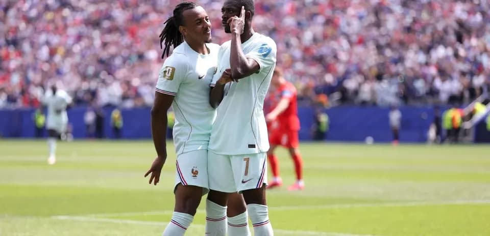 Two France players celebrating on the field