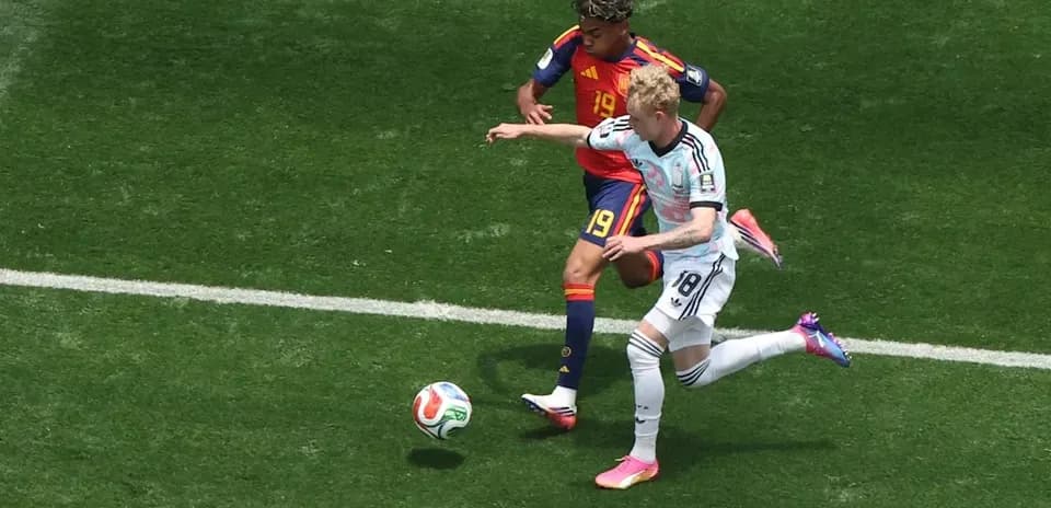 Two players contesting the ball during a match