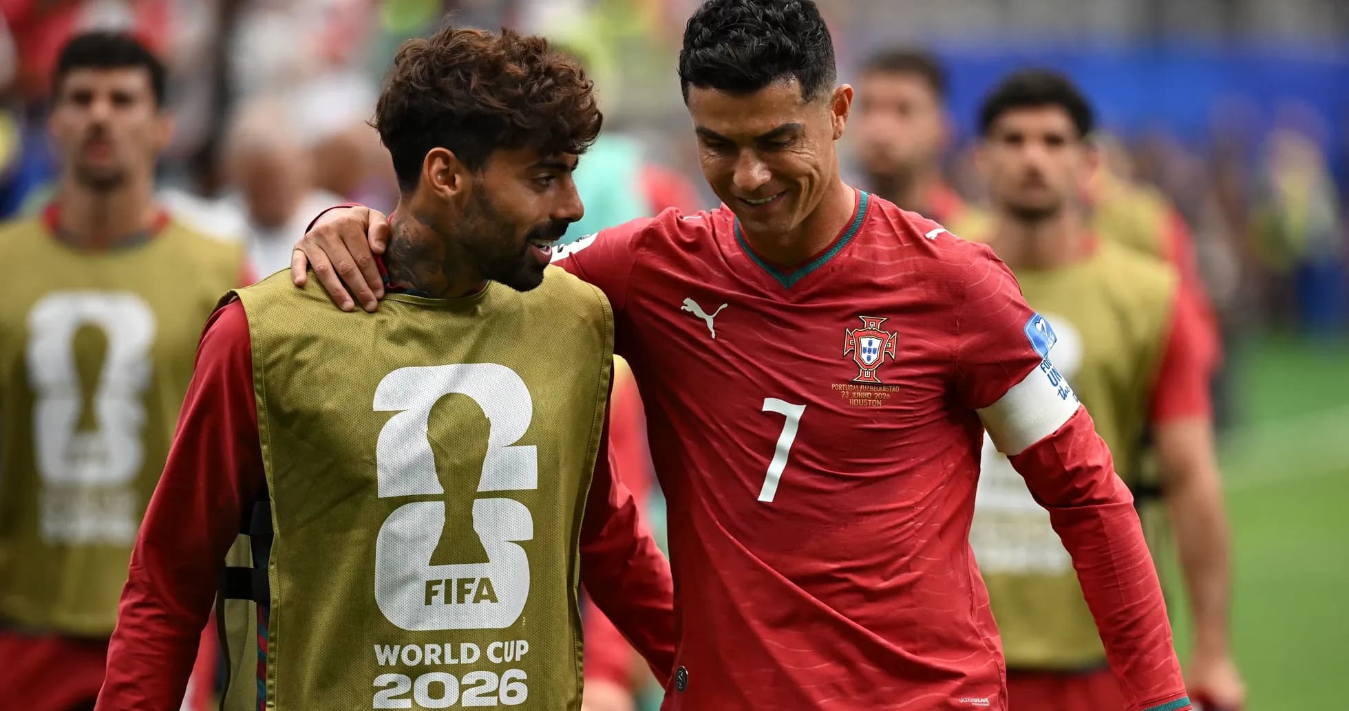 Two Portuguese players interacting before the match