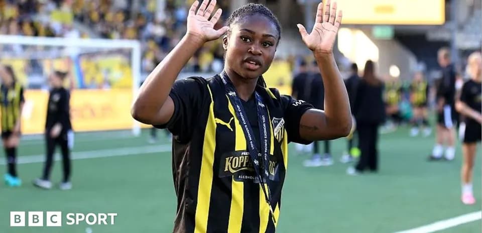 Player waving on the pitch after the match