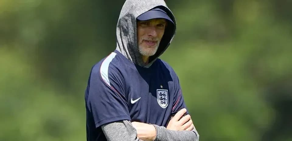 Coach observing training session with hooded sweatshirt
