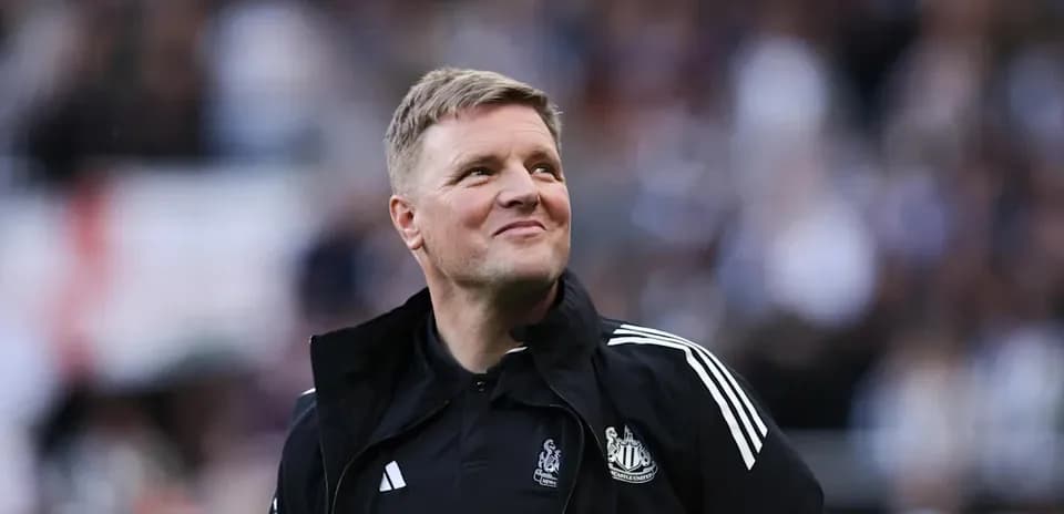 Newcastle United manager smiling during match