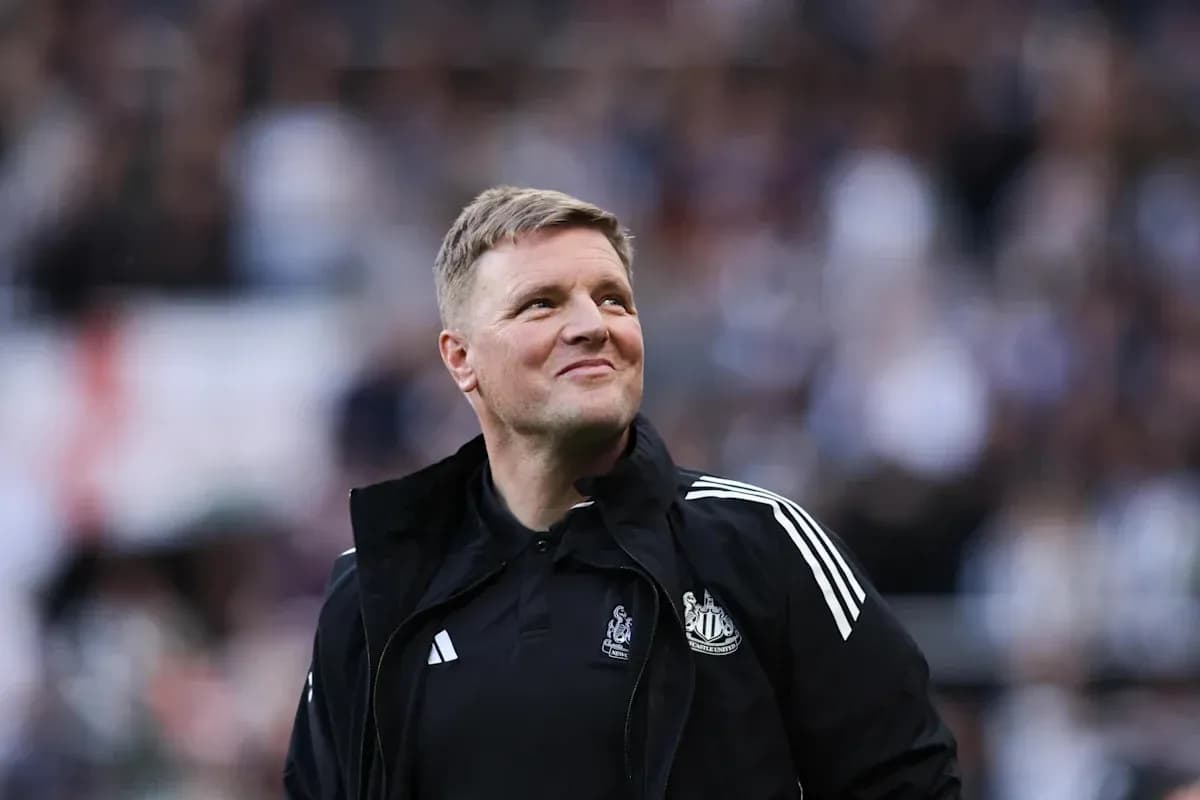 Newcastle United manager smiling during match