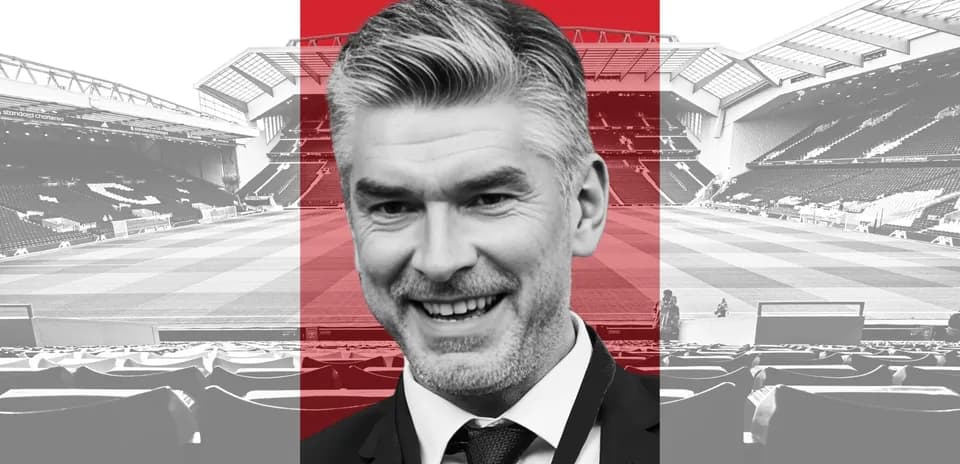 Man smiling with stadium in background