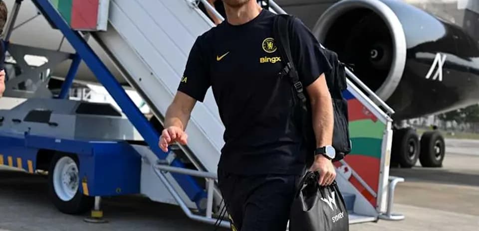 Football coach arriving at airport with luggage