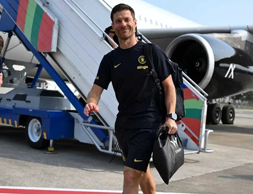 Football coach arriving at airport with luggage
