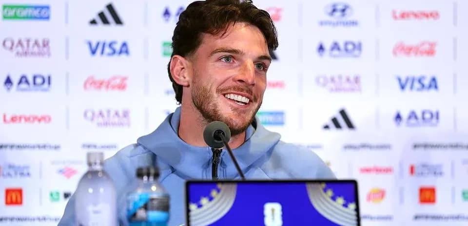 Player speaking at press conference with sponsor backdrop