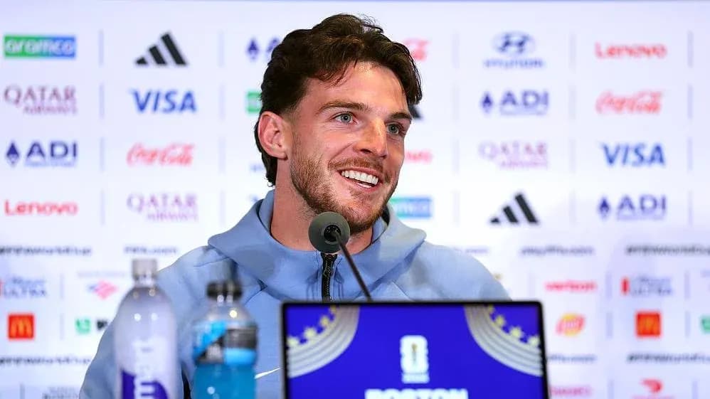 Player speaking at press conference with sponsor backdrop