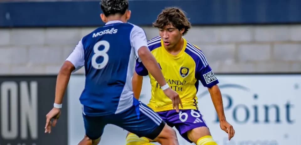 Two players competing during Orlando City II match