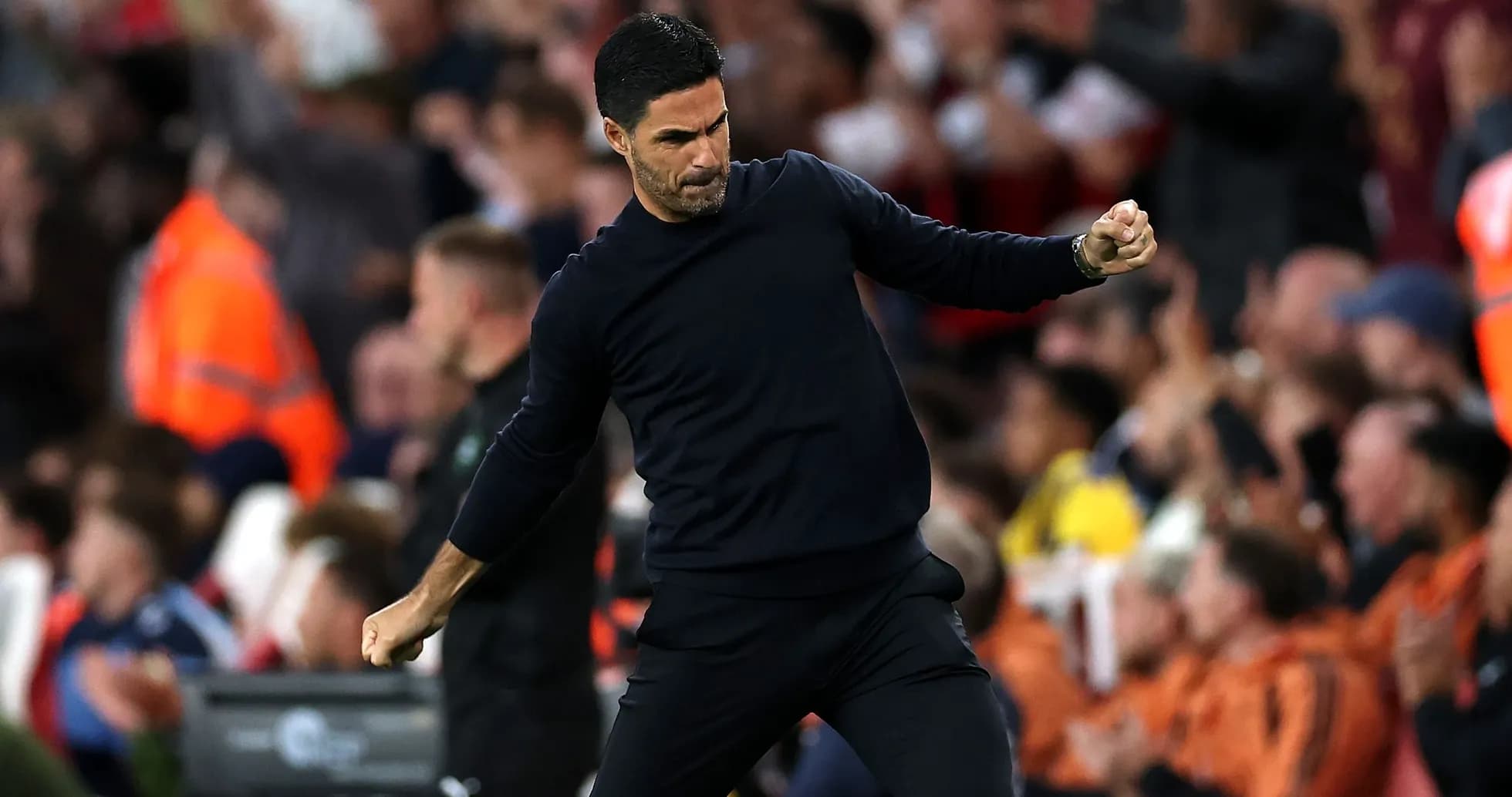 Manager celebrating a goal during a match