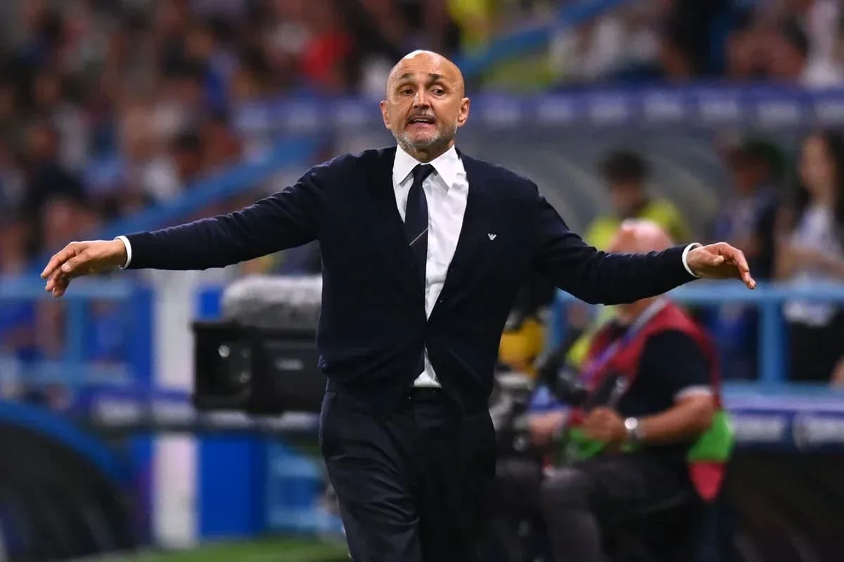 Coach gesturing during a football match on sidelines