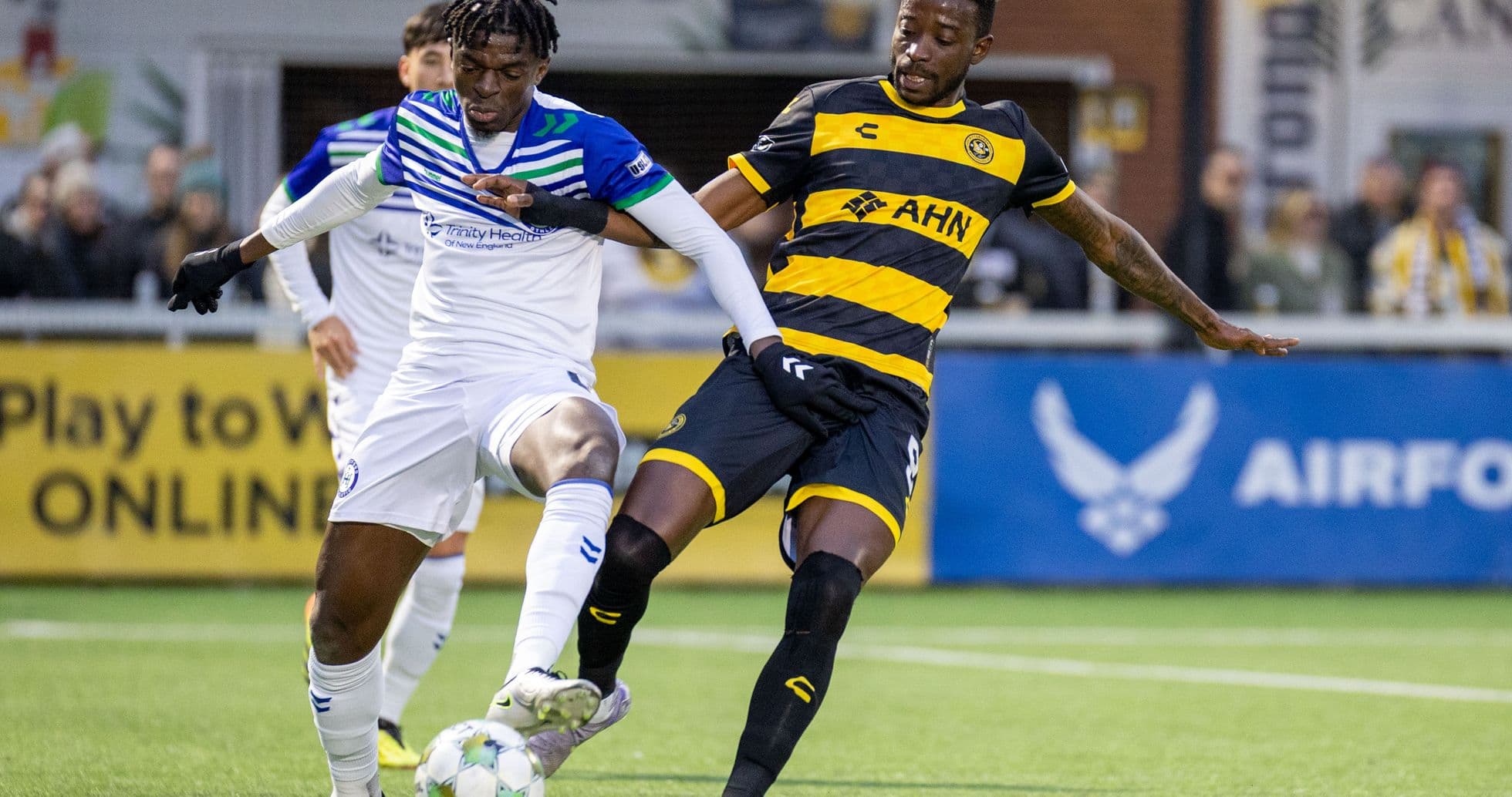 Players competing for the ball in USL match