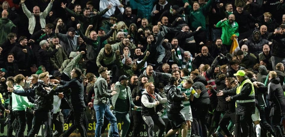 Crowd celebrating a goal at a football match