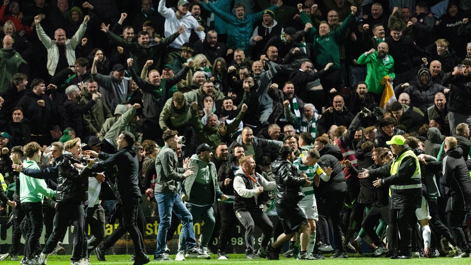 Crowd celebrating a goal at a football match