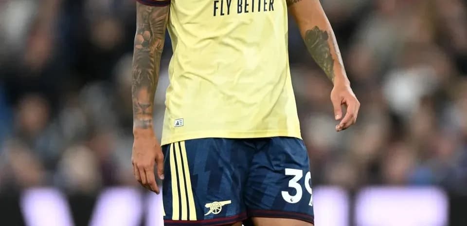 Player wearing Arsenal kit on the pitch