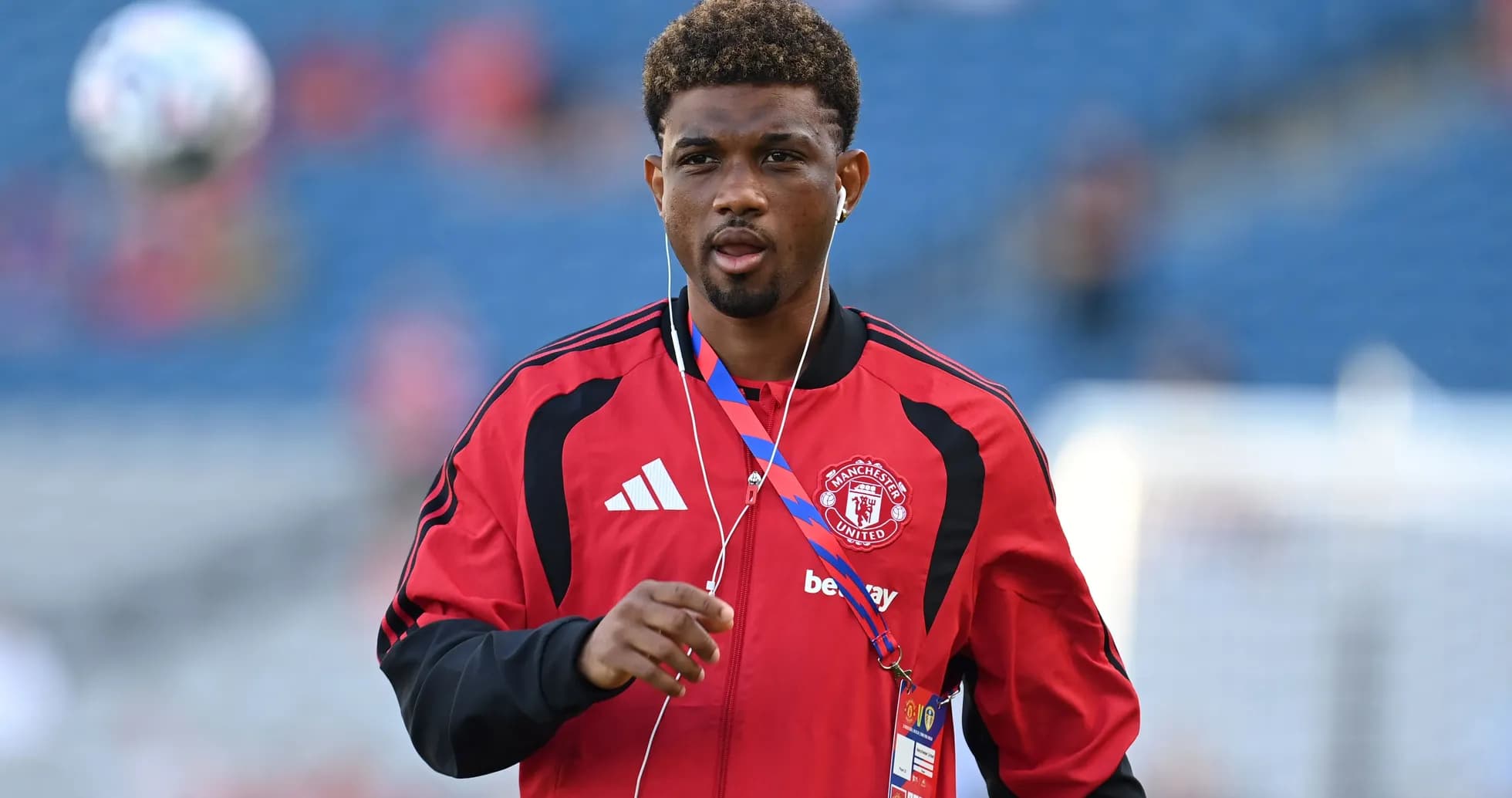 Player in Manchester United training gear on pitch