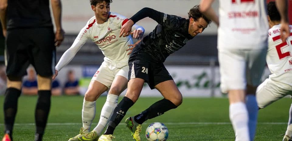 Players competing for the ball during match