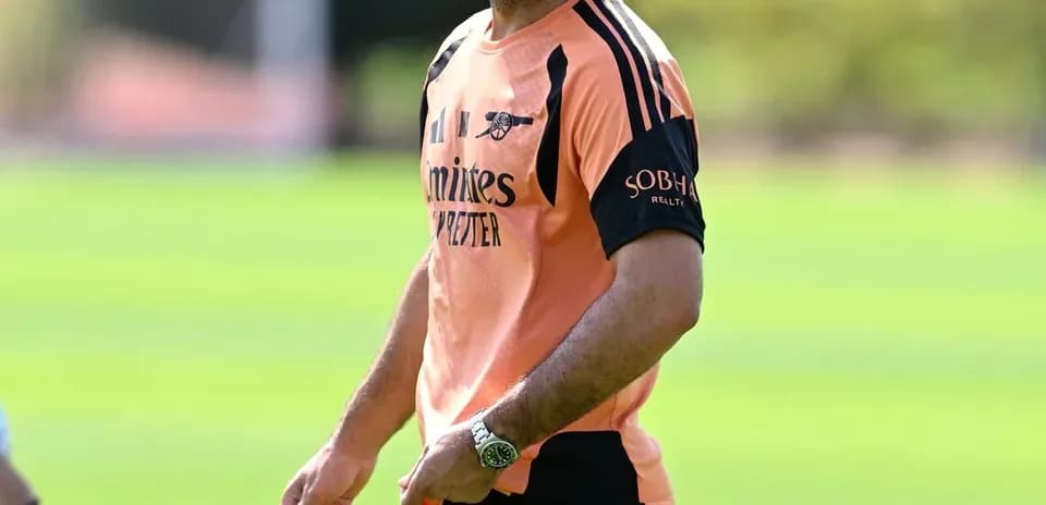 Coach smiling during training session on the pitch