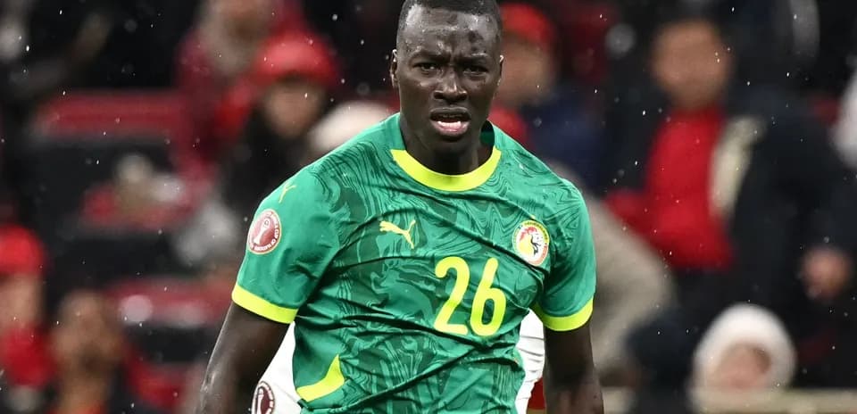 Player wearing Senegal jersey during match action
