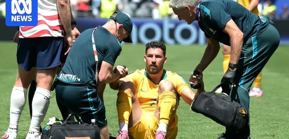Player receiving medical attention on the field