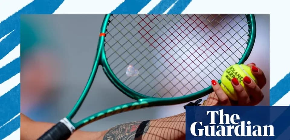 Tennis player holding racket and ball in hand