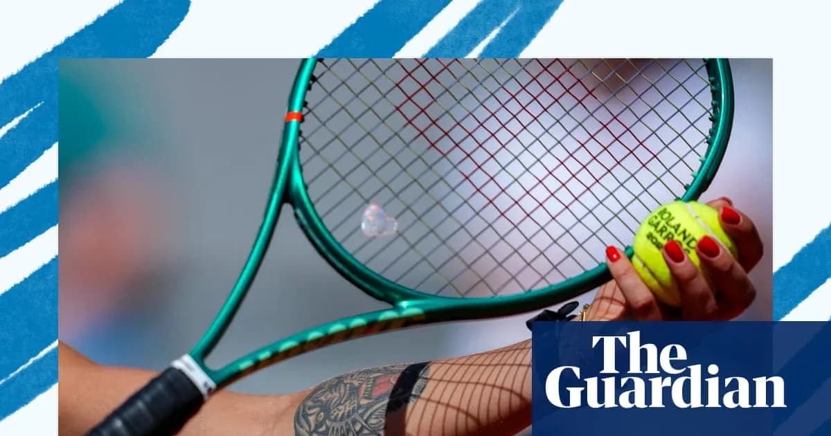 Tennis player holding racket and ball in hand