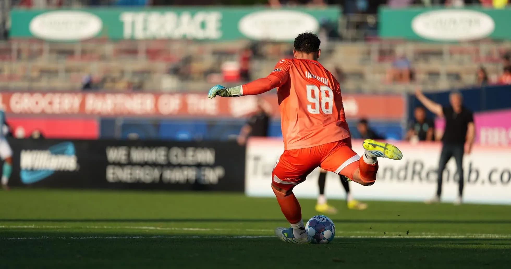 Goalkeeper preparing to kick the ball