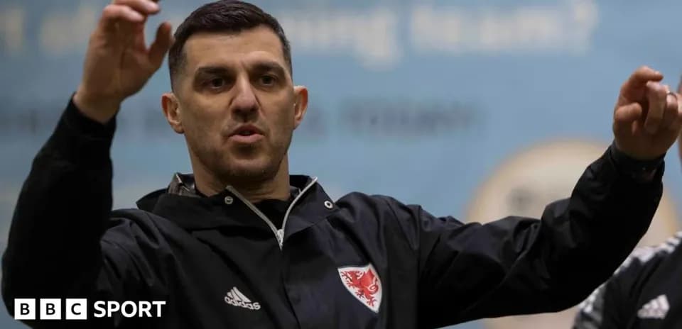 Coach gesturing during training session indoors