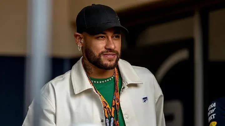 Man in casual attire smiling at an event