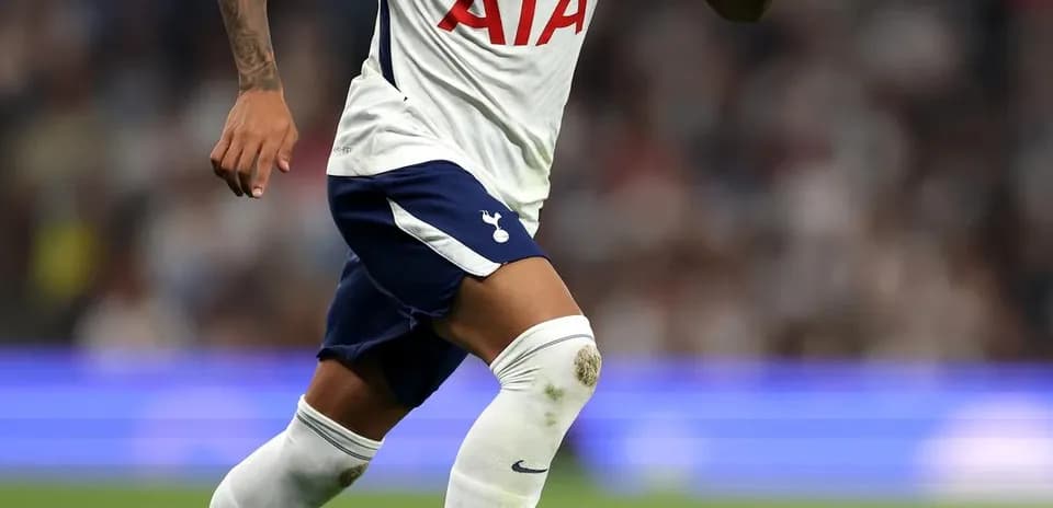 Player dribbling ball during match for Tottenham