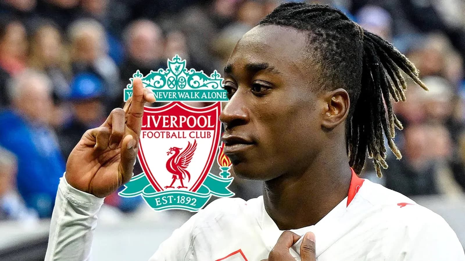 Player celebrating in front of Liverpool FC logo