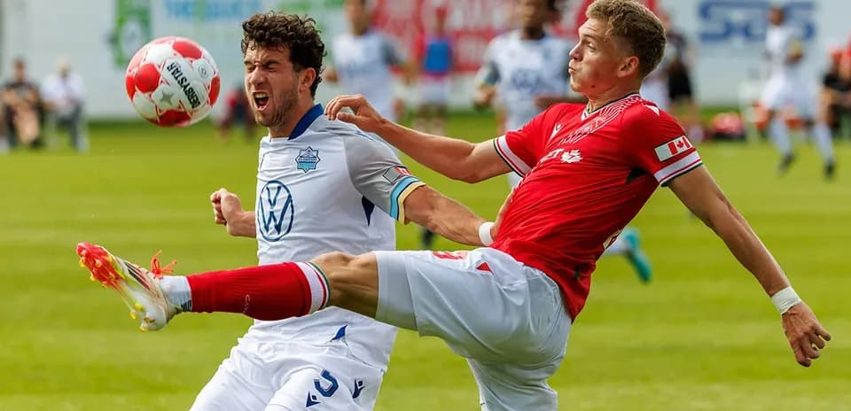 Players competing for the ball during match