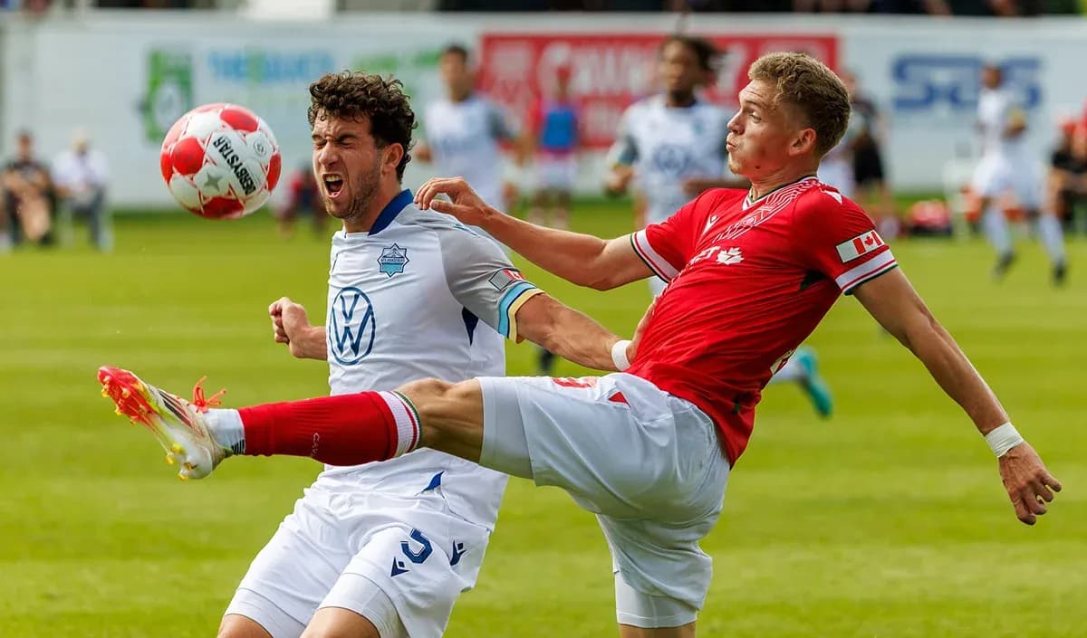 Players competing for the ball during match