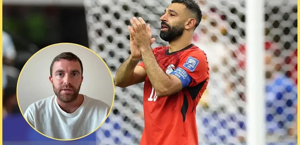 Player in red jersey applauding on the field