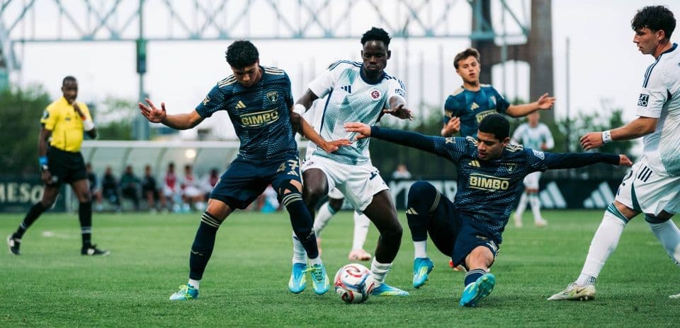 Players competing for the ball during match