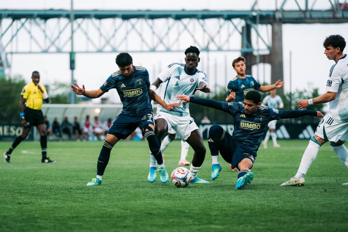 Players competing for the ball during match