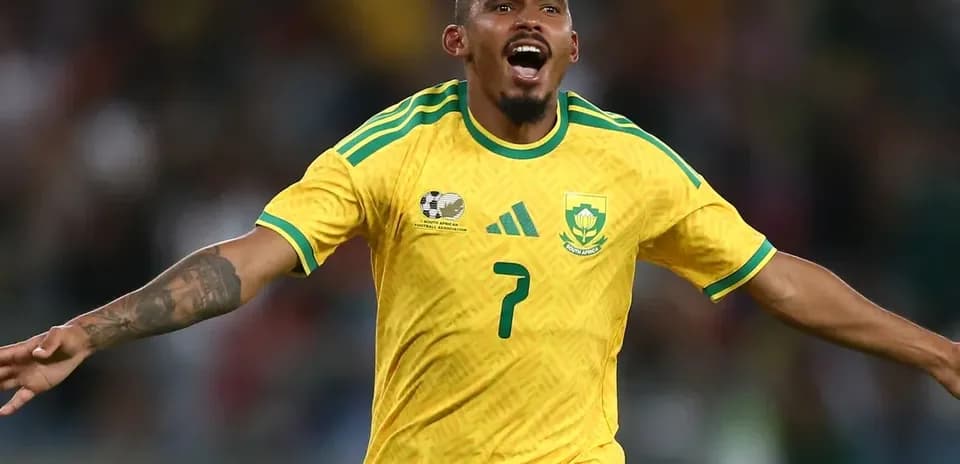 Player celebrating a goal in yellow jersey