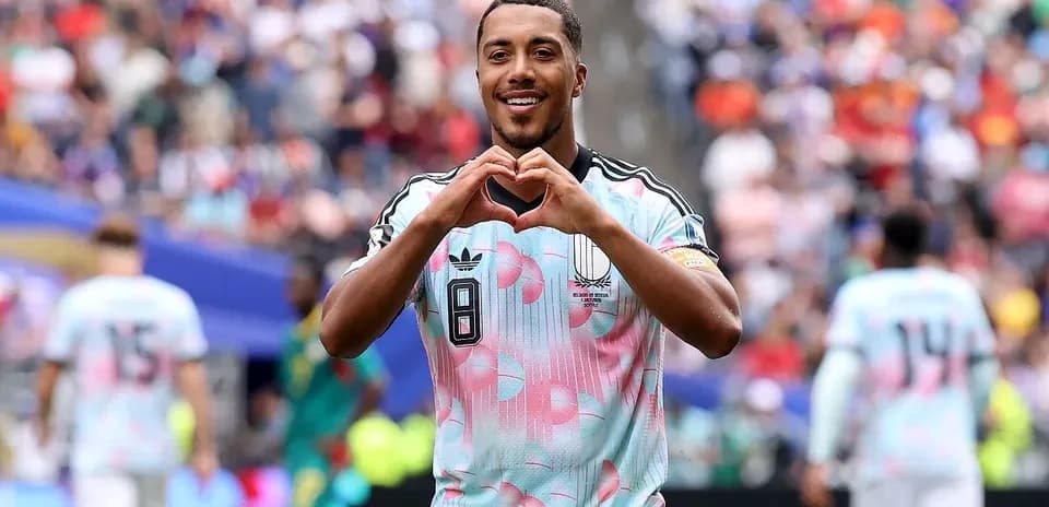 Player making heart gesture after scoring goal