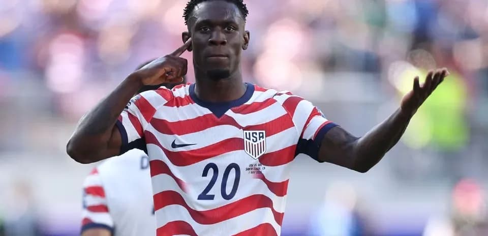 Player celebrating a goal in USA jersey