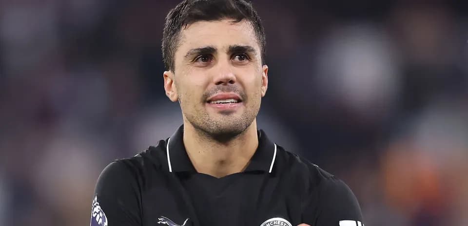 Player wearing black jersey during match celebration