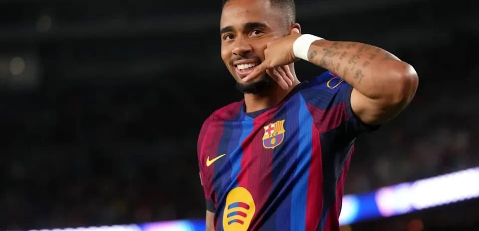 Player celebrating with phone gesture after scoring