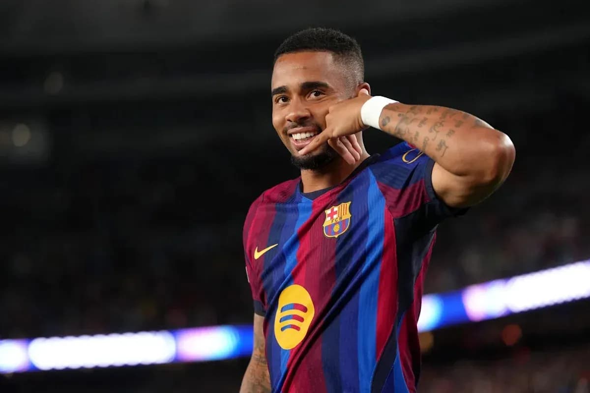 Player celebrating with phone gesture after scoring