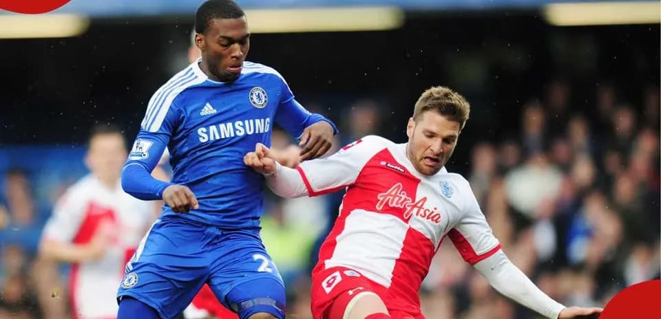 Two players contesting for the ball during match