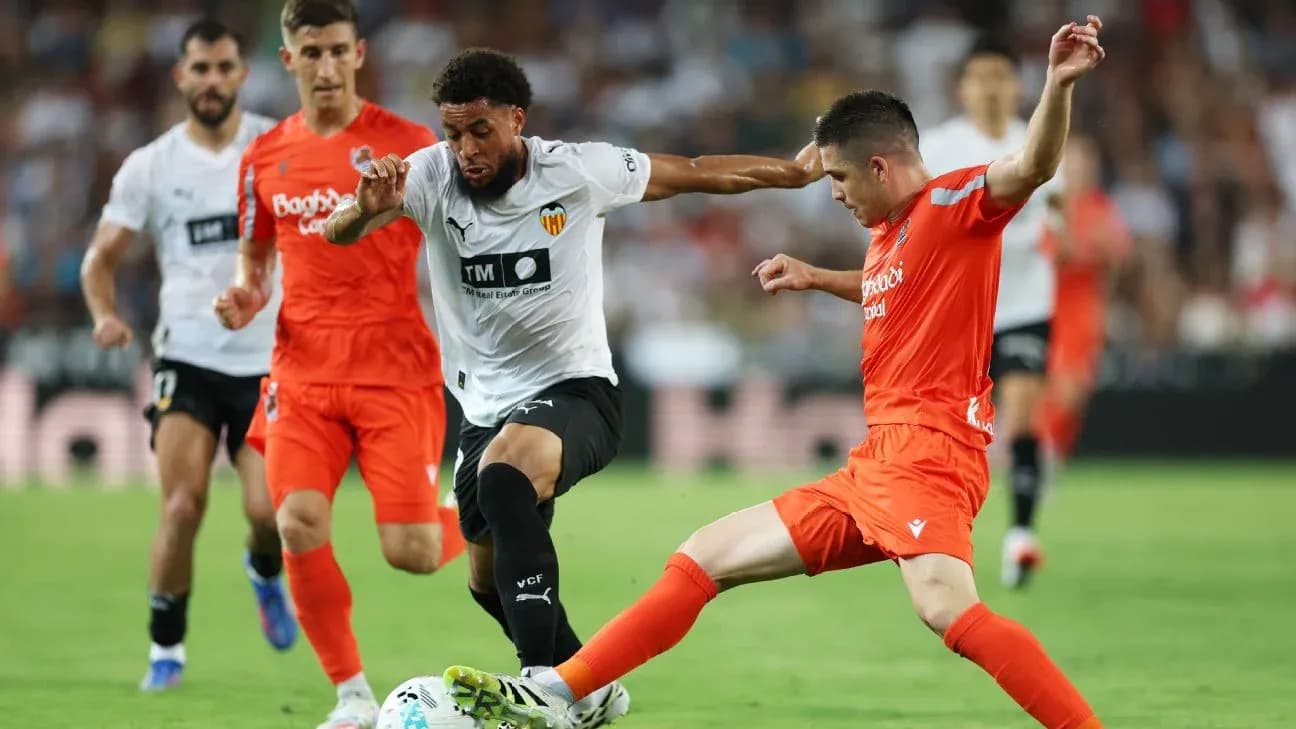 Players contesting the ball during La Liga match